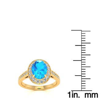 1 3/4 Carat Oval Shape Blue Topaz and Halo Diamond Ring In 14 Karat Yellow Gold