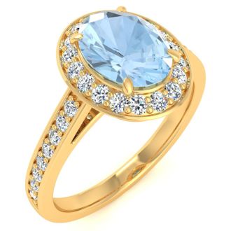 Aquamarine Ring: Aquamarine Jewelry: 1 1/2 Carat Oval Shape Aquamarine and Halo Diamond Ring In 14 Karat Yellow Gold