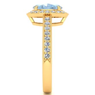 Aquamarine Ring: Aquamarine Jewelry: 1 1/2 Carat Oval Shape Aquamarine and Halo Diamond Ring In 14 Karat Yellow Gold