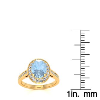 Aquamarine Ring: Aquamarine Jewelry: 1 1/2 Carat Oval Shape Aquamarine and Halo Diamond Ring In 14 Karat Yellow Gold