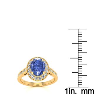 1 1/2 Carat Oval Shape Tanzanite and Halo Diamond Ring In 14 Karat Yellow Gold