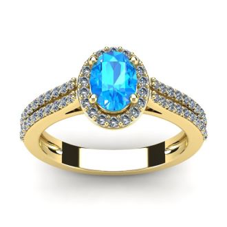 1 1/2 Carat Oval Shape Blue Topaz and Halo Diamond Ring In 14 Karat Yellow Gold