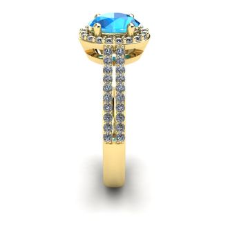 1 1/2 Carat Oval Shape Blue Topaz and Halo Diamond Ring In 14 Karat Yellow Gold