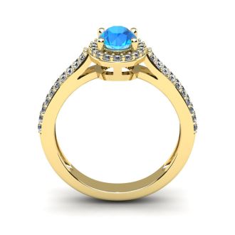 1 1/2 Carat Oval Shape Blue Topaz and Halo Diamond Ring In 14 Karat Yellow Gold