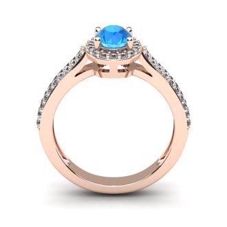 1 1/2 Carat Oval Shape Blue Topaz and Halo Diamond Ring In 14 Karat Rose Gold