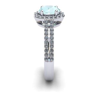 Aquamarine Ring: Aquamarine Jewelry: 1 1/4 Carat Oval Shape Aquamarine and Halo Diamond Ring In 14 Karat White Gold