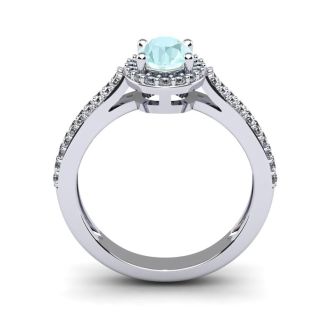 Aquamarine Ring: Aquamarine Jewelry: 1 1/4 Carat Oval Shape Aquamarine and Halo Diamond Ring In 14 Karat White Gold