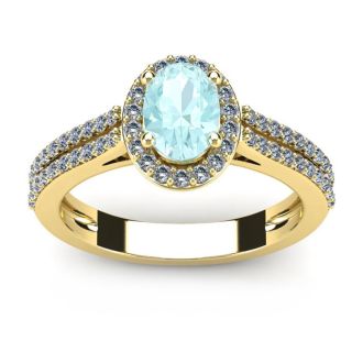 Aquamarine Ring: Aquamarine Jewelry: 1 1/4 Carat Oval Shape Aquamarine and Halo Diamond Ring In 14 Karat Yellow Gold