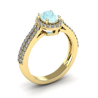 Aquamarine Ring: Aquamarine Jewelry: 1 1/4 Carat Oval Shape Aquamarine and Halo Diamond Ring In 14 Karat Yellow Gold