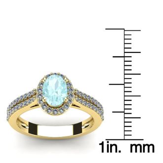 Aquamarine Ring: Aquamarine Jewelry: 1 1/4 Carat Oval Shape Aquamarine and Halo Diamond Ring In 14 Karat Yellow Gold