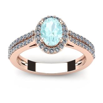 Aquamarine Ring: Aquamarine Jewelry: 1 1/4 Carat Oval Shape Aquamarine and Halo Diamond Ring In 14 Karat Rose Gold