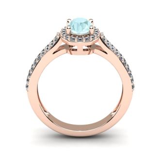 Aquamarine Ring: Aquamarine Jewelry: 1 1/4 Carat Oval Shape Aquamarine and Halo Diamond Ring In 14 Karat Rose Gold