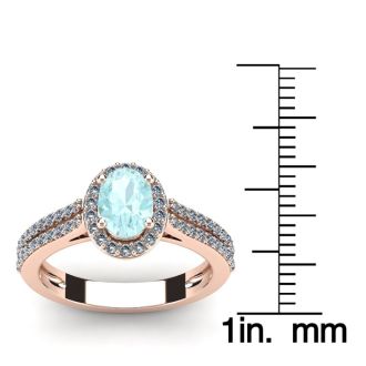 Aquamarine Ring: Aquamarine Jewelry: 1 1/4 Carat Oval Shape Aquamarine and Halo Diamond Ring In 14 Karat Rose Gold