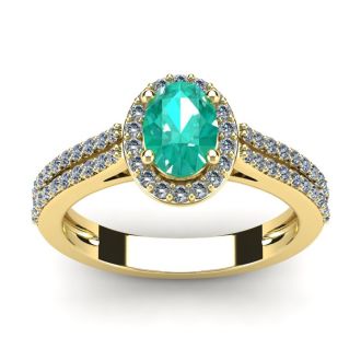 1 1/4 Carat Oval Shape Emerald and Halo Diamond Ring In 14 Karat Yellow Gold