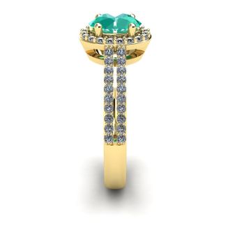 1 1/4 Carat Oval Shape Emerald and Halo Diamond Ring In 14 Karat Yellow Gold