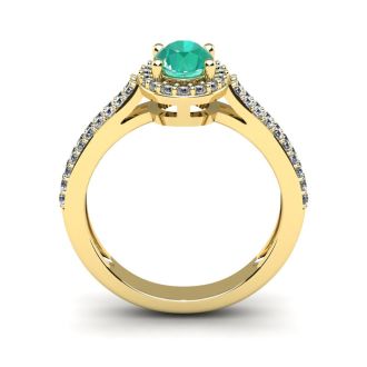 1 1/4 Carat Oval Shape Emerald and Halo Diamond Ring In 14 Karat Yellow Gold