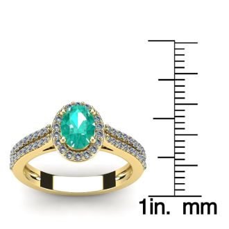 1 1/4 Carat Oval Shape Emerald and Halo Diamond Ring In 14 Karat Yellow Gold