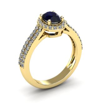1 1/2 Carat Oval Shape Sapphire and Halo Diamond Ring In 14 Karat Yellow Gold
