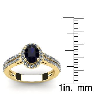 1 1/2 Carat Oval Shape Sapphire and Halo Diamond Ring In 14 Karat Yellow Gold