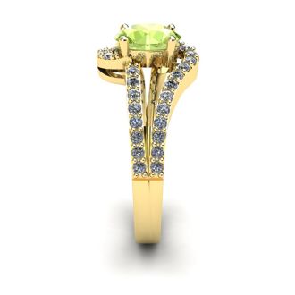 1 1/3 Carat Oval Shape Peridot and Fancy Diamond Ring In 14 Karat Yellow Gold