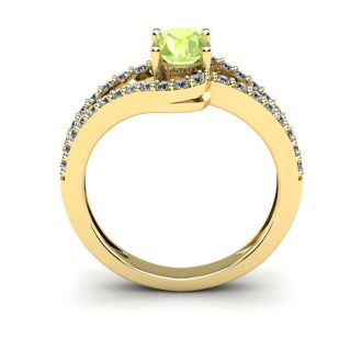 1 1/3 Carat Oval Shape Peridot and Fancy Diamond Ring In 14 Karat Yellow Gold