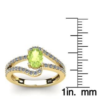 1 1/3 Carat Oval Shape Peridot and Fancy Diamond Ring In 14 Karat Yellow Gold