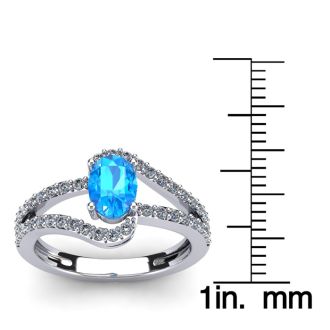 1 1/2 Carat Oval Shape Blue Topaz and Fancy Diamond Ring In 14 Karat White Gold