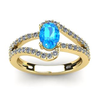 1 1/2 Carat Oval Shape Blue Topaz and Fancy Diamond Ring In 14 Karat Yellow Gold