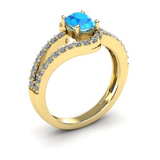 1 1/2 Carat Oval Shape Blue Topaz and Fancy Diamond Ring In 14 Karat Yellow Gold