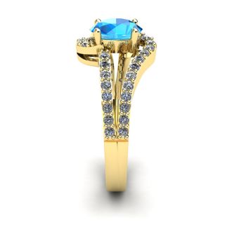 1 1/2 Carat Oval Shape Blue Topaz and Fancy Diamond Ring In 14 Karat Yellow Gold