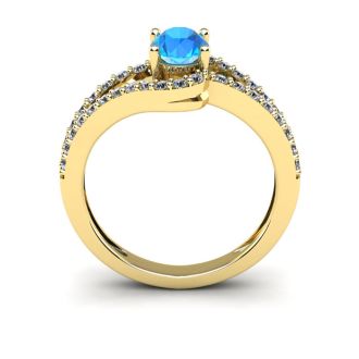 1 1/2 Carat Oval Shape Blue Topaz and Fancy Diamond Ring In 14 Karat Yellow Gold