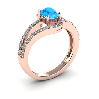 1 1/2 Carat Oval Shape Blue Topaz and Fancy Diamond Ring In 14 Karat Rose Gold
