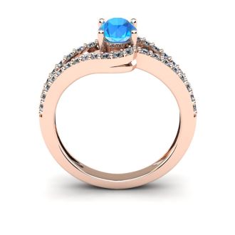 1 1/2 Carat Oval Shape Blue Topaz and Fancy Diamond Ring In 14 Karat Rose Gold
