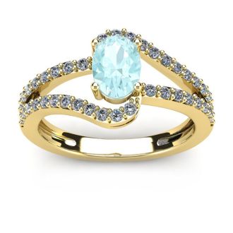 1 1/4 Carat Oval Shape Aquamarine and Fancy Diamond Ring In 14 Karat Yellow Gold