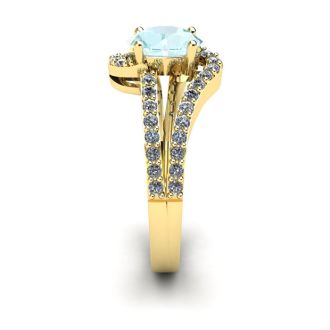 Aquamarine Ring: Aquamarine Jewelry: 1 1/4 Carat Oval Shape Aquamarine and Fancy Diamond Ring In 14 Karat Yellow Gold