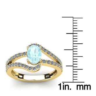 1 1/4 Carat Oval Shape Aquamarine and Fancy Diamond Ring In 14 Karat Yellow Gold