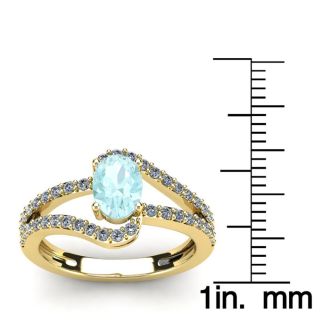 Aquamarine Ring: Aquamarine Jewelry: 1 1/4 Carat Oval Shape Aquamarine and Fancy Diamond Ring In 14 Karat Yellow Gold
