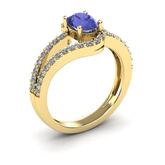 1 1/3 Carat Oval Shape Tanzanite and Fancy Diamond Ring In 14 Karat Yellow Gold