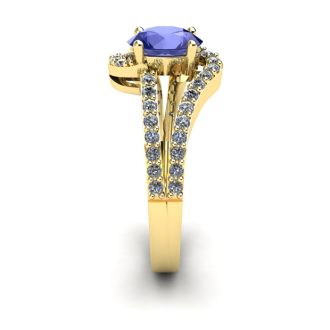 1 1/3 Carat Oval Shape Tanzanite and Fancy Diamond Ring In 14 Karat Yellow Gold