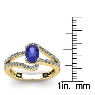 1 1/3 Carat Oval Shape Tanzanite and Fancy Diamond Ring In 14 Karat Yellow Gold