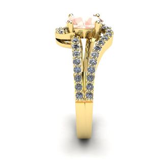 1 1/4 Carat Oval Shape Morganite and Fancy Diamond Ring In 14 Karat Yellow Gold