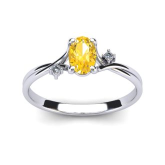 1/2 Carat Oval Shape Citrine and Two Diamond Accent Ring In 14 Karat White Gold