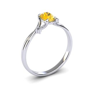1/2 Carat Oval Shape Citrine and Two Diamond Accent Ring In 14 Karat White Gold