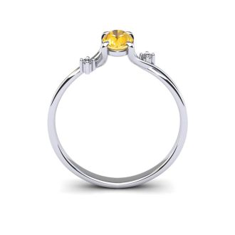 1/2 Carat Oval Shape Citrine and Two Diamond Accent Ring In 14 Karat White Gold