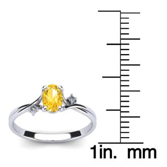 1/2 Carat Oval Shape Citrine and Two Diamond Accent Ring In 14 Karat White Gold