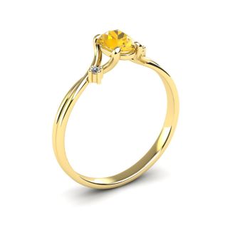 1/2 Carat Oval Shape Citrine and Two Diamond Accent Ring In 14 Karat Yellow Gold