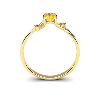 1/2 Carat Oval Shape Citrine and Two Diamond Accent Ring In 14 Karat Yellow Gold