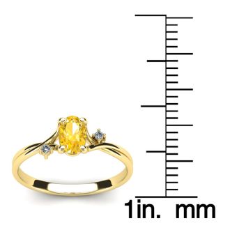 1/2 Carat Oval Shape Citrine and Two Diamond Accent Ring In 14 Karat Yellow Gold