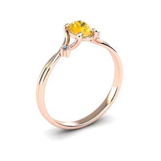 1/2 Carat Oval Shape Citrine and Two Diamond Accent Ring In 14 Karat Rose Gold