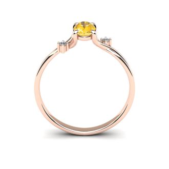 1/2 Carat Oval Shape Citrine and Two Diamond Accent Ring In 14 Karat Rose Gold